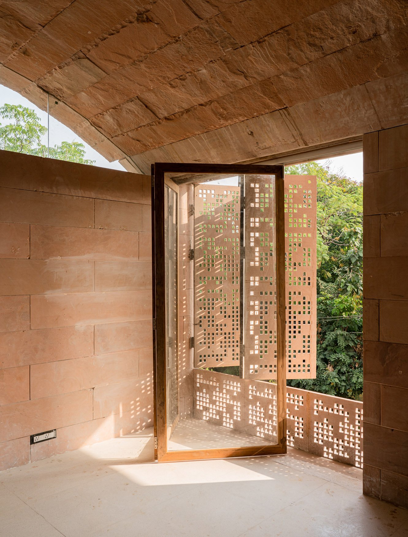 The light into the living and sleeping spaces is controlled through the operation of hand-crafted stone screens ( Jaalis). The naturally textured weight of the compression vaults amplifies the ethereal lig | Fabien Charuau