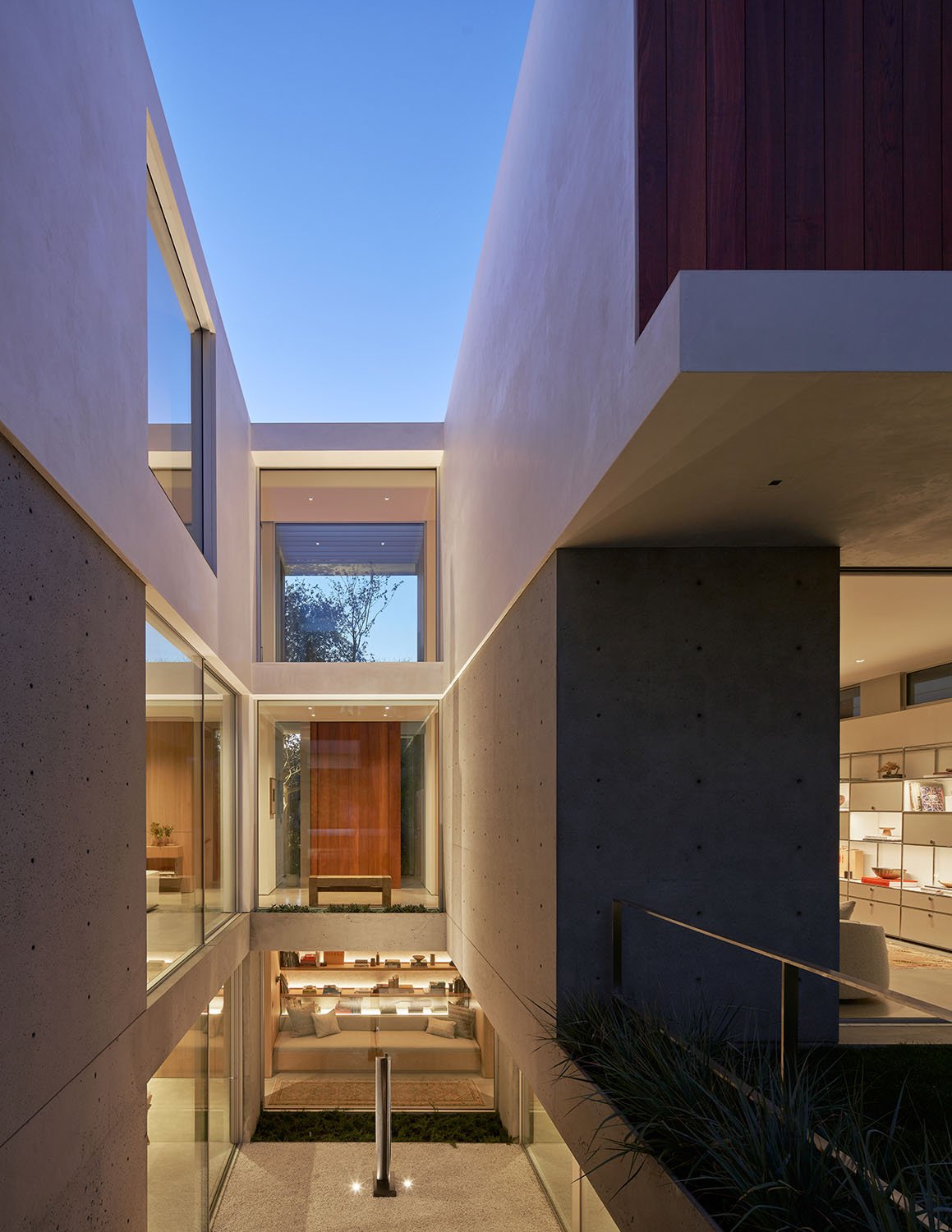 The three-story courtyard/ atrium feeds light through each of the floors, while providing sight lines to the backyard, and above and below. | Kevin Scott