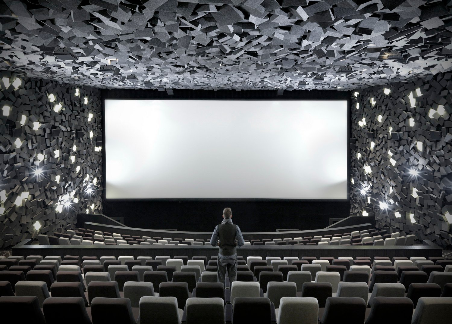 Grey three dimensional square-shaped boxes of sound absorbing materials surround the auditorium | 