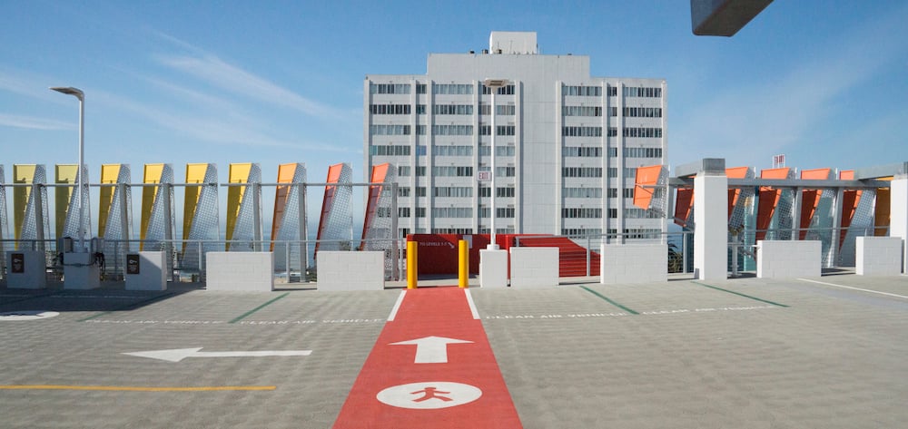 Way-finding confusion - a problem that plagues most parking garages - is reduced via clear pedestrian signage leading to the exterior stairs. | 