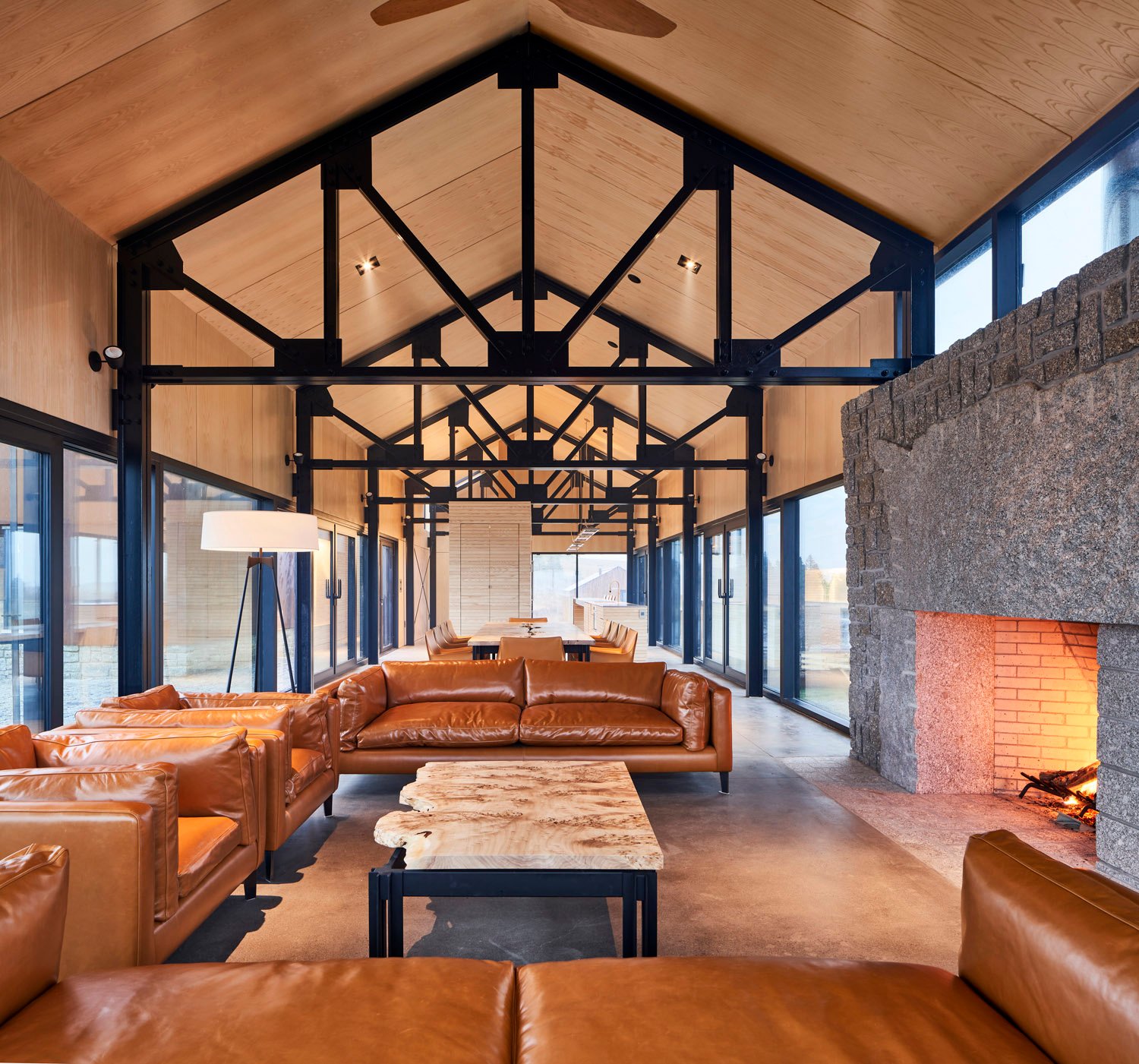 The polished concrete floor is contrasted by the white ash plywood ceiling | doublespace photography inc