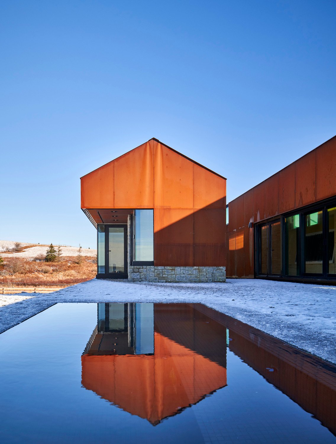 The night pavilion reflected in the infinity hot tub | doublespace photography inc