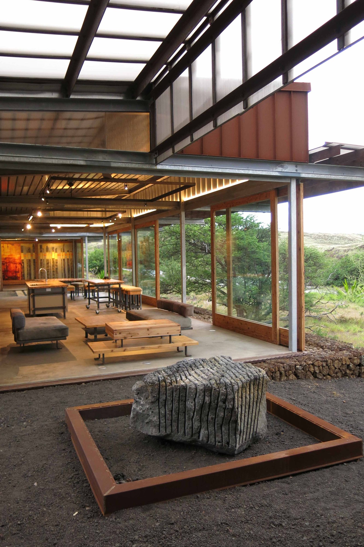 With sliding wall/window panels open, the indoor spaces can be opened to the surrounding landscape. | John Russell