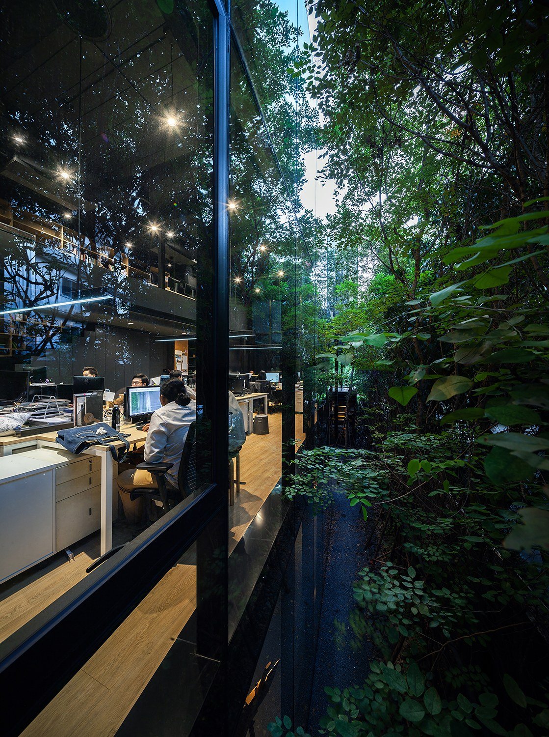 Working space on thee upstairs is kept private and surrounded by evergreen trees. | Spaceshift