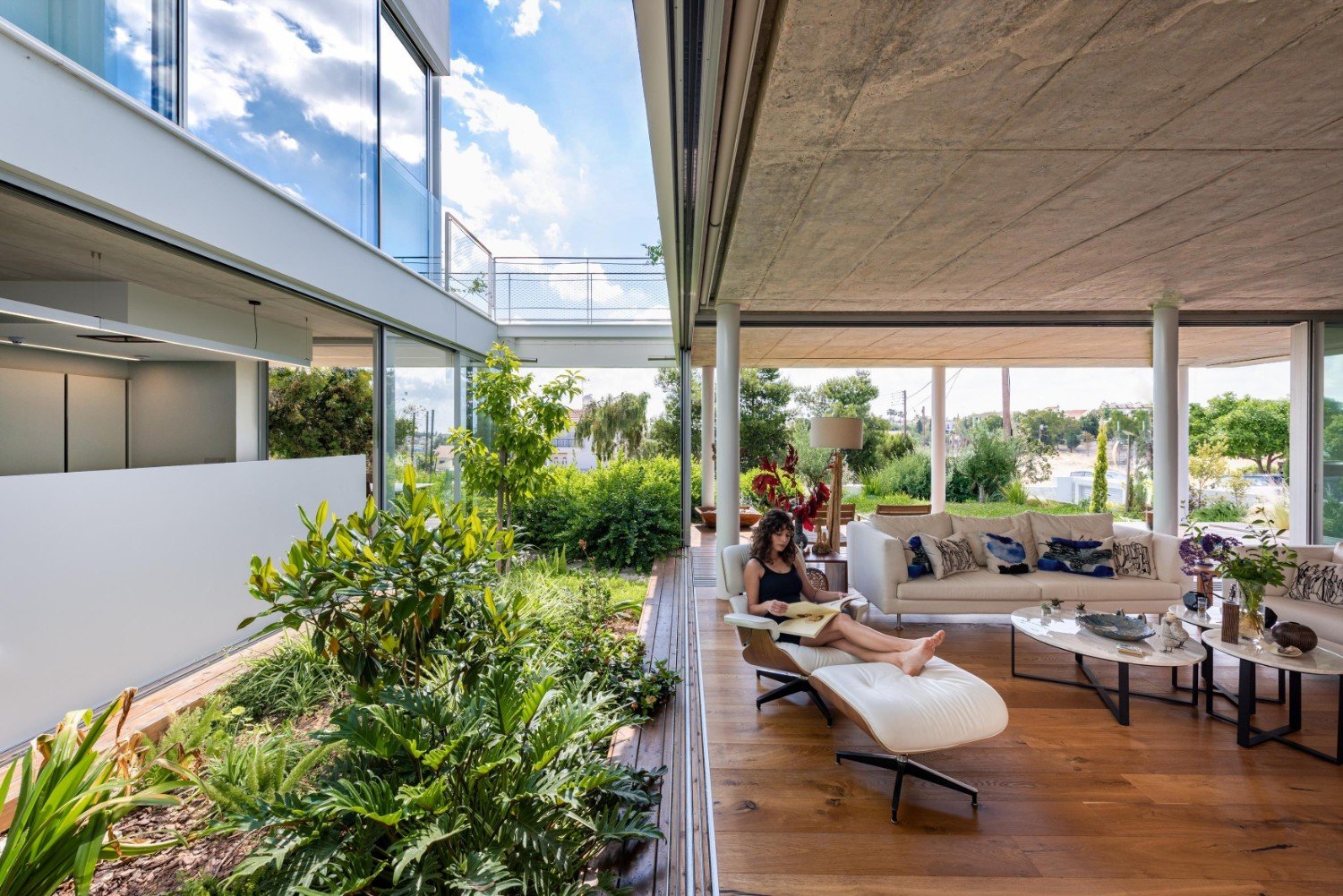 living / kitchen areas , green courtyard highlights nature's beauty in the living room. | unseen views