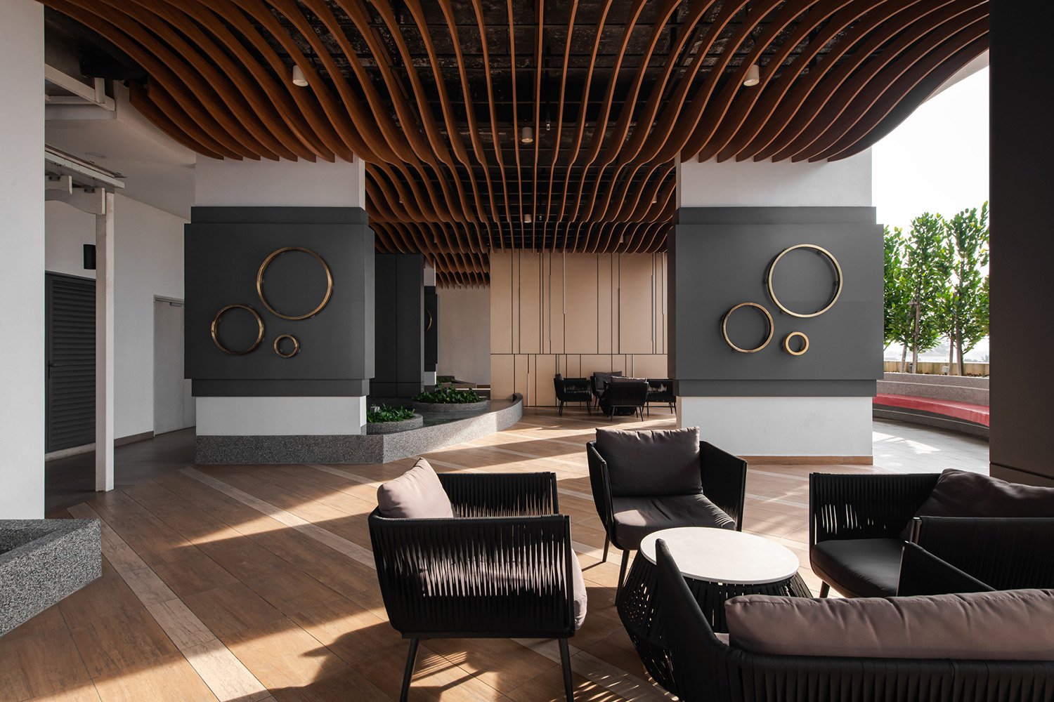 Reading deck with wavy ceiling panels mimicking the same language as the façade. | David Yeow