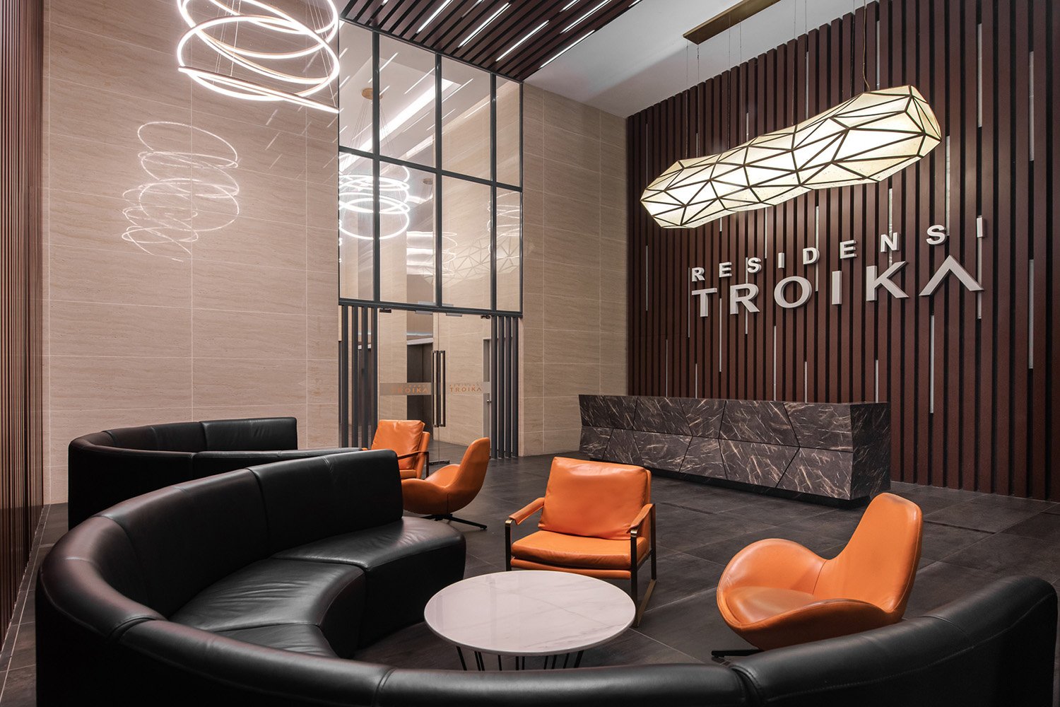 Double volume serviced apartment lobby with comfortable lighting creates relaxing atmosphere to welcome the visitors. | David Yeow
