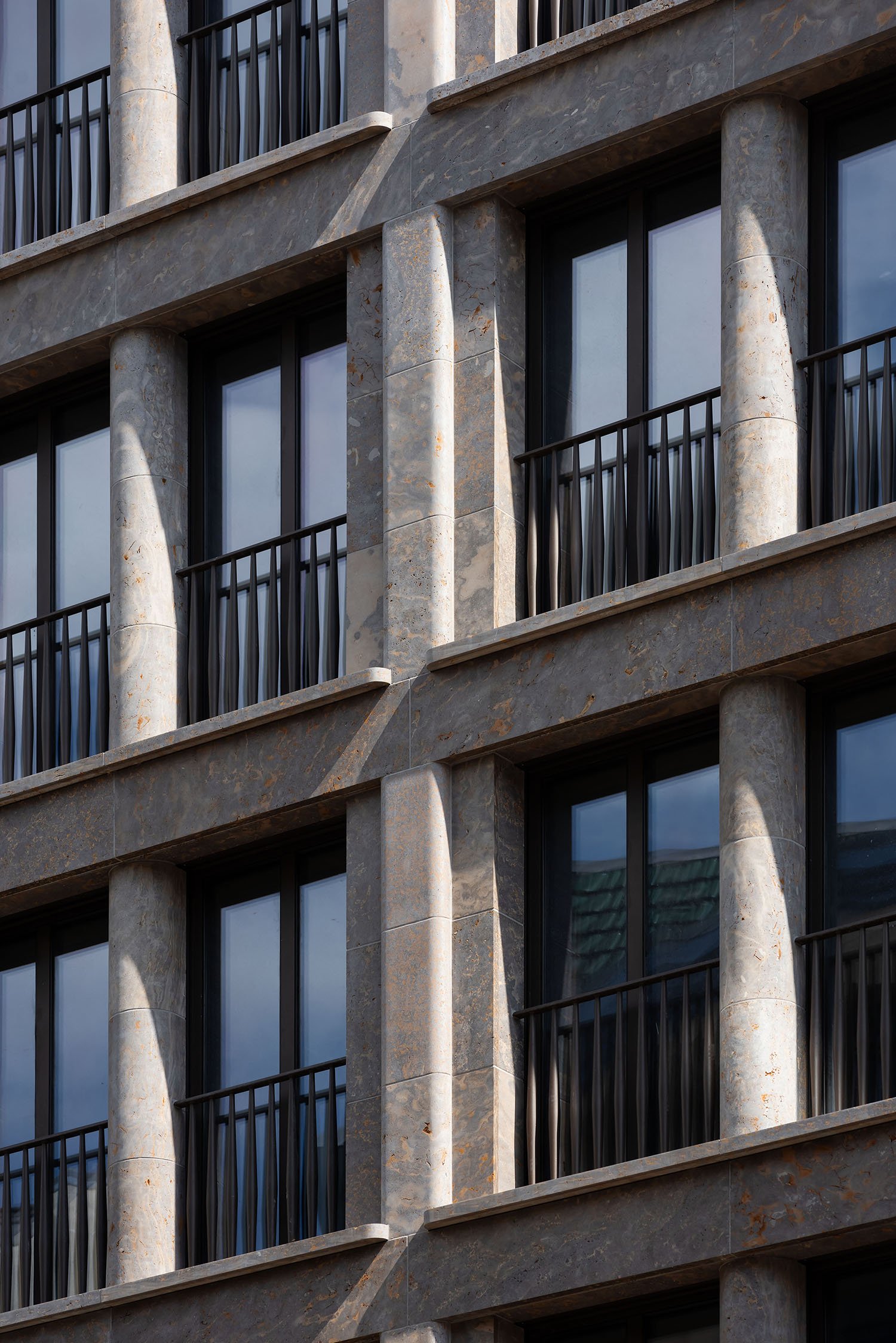 The grey natural stone façade of house 43. | Ilya Ivanov