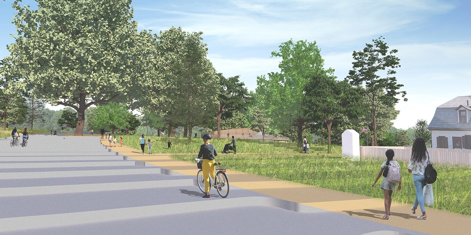 Approach view from parking illustrating building integration into the sloping terrain | ikon.5 architects