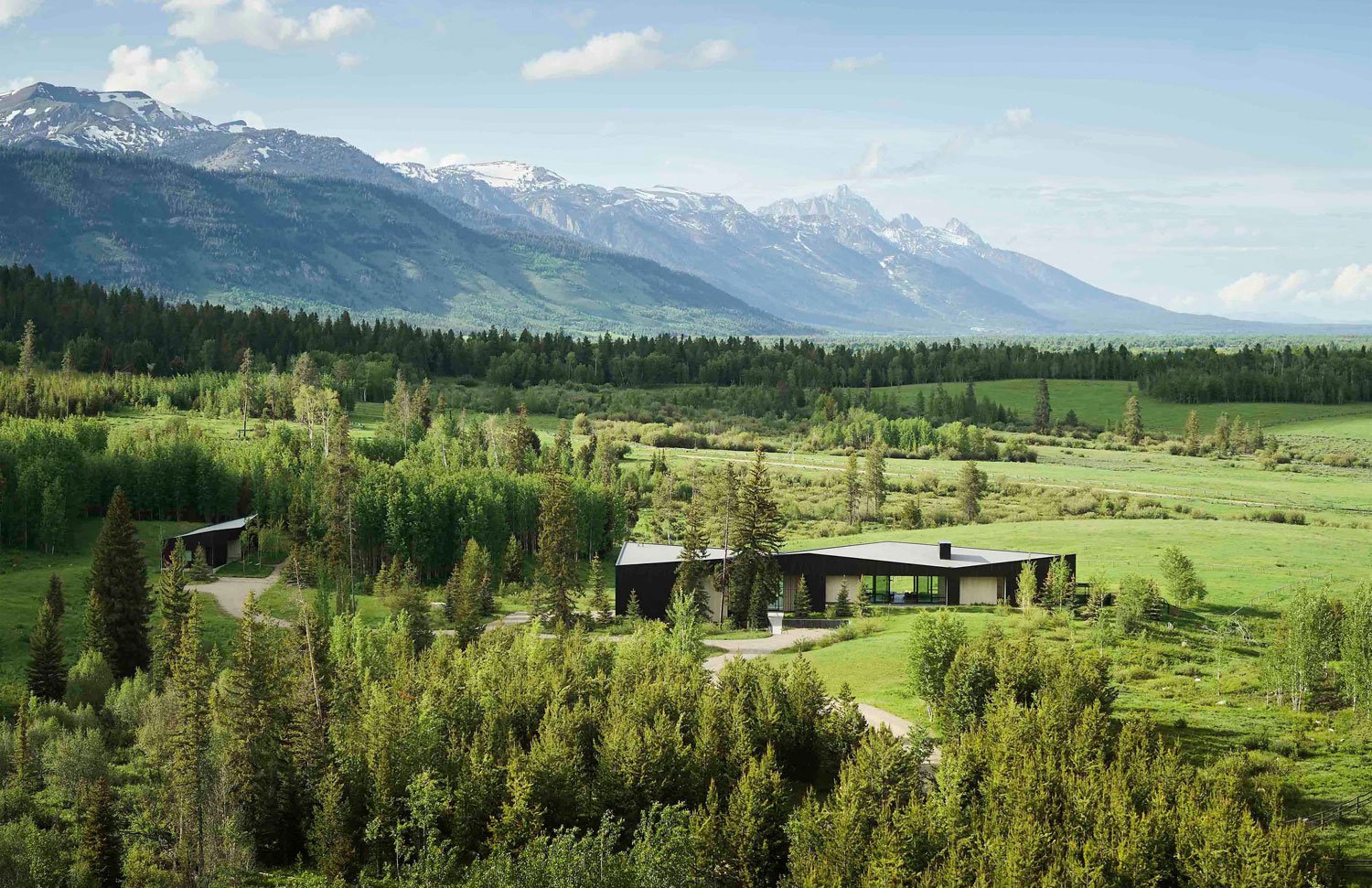 The 35-acre property is set at the base of the Tetons and encompasses several ecosystems, with old-growth forest merging into stands of young pine and aspen trees before transitioning into rolling meadows. | Matthew Millman