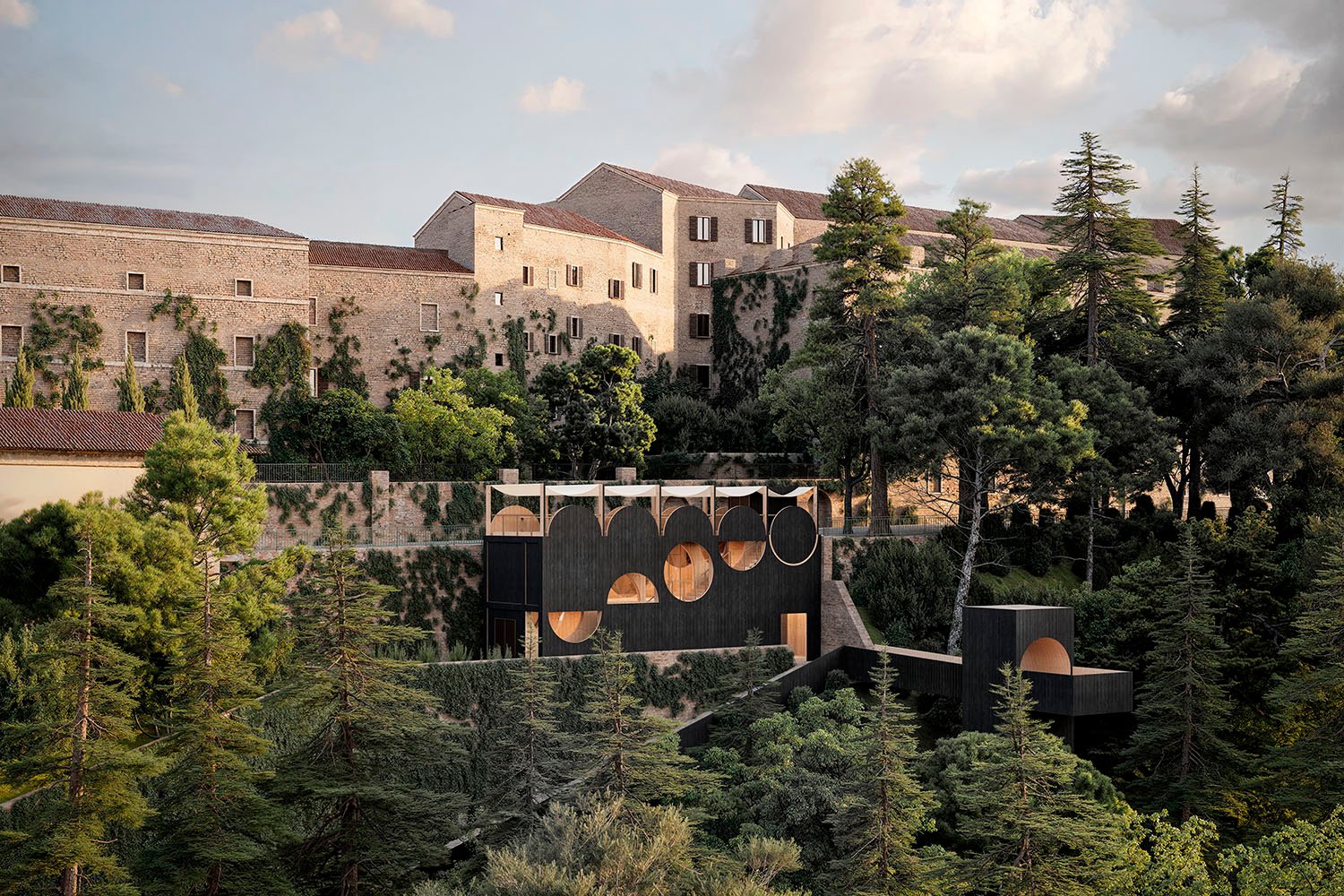 Panoramic view of the MuMo pavilion nestled below the historic walls of Montalto delle Marche | SSA