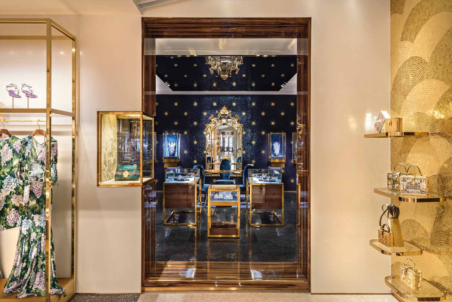 © Antoine Huot, courtesy Carbondale | The walls of the ground floor corridor are lined with gold leaf mosaic handcrafted by local artisans; Dolce & Gabbana accessories and bags are displayed on the brass shelving running along them.