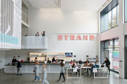 When the theaters are “dark,” the building remains a welcoming oasis, open to the public as a café and community gathering space. The metal-framed pink-neon letters from the cinema’s marquee, originally in | 