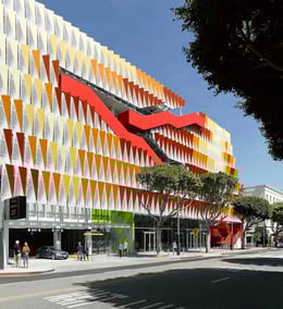 Stairs cascade up and down the exterior, weaving in and out of the plane of the façade. | 