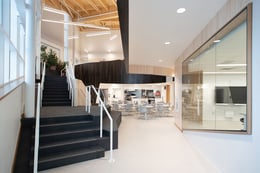 Interior view of the monumental stone stair with a view into the Fur Production Classroom. | Julie Jira