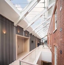 Glazed lobby to Recital Hall enhances the Academy’s circulation routes, creating a link between the old and new buildings | Adam Scott