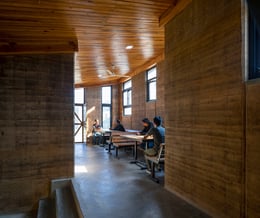 Interior of the dormitory, showing the rammed earth interiors. | Elizabeth Felicella