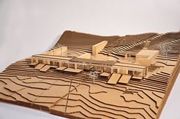 Early design process model in laser cut wood and cardboard. Aerial view from southeast to show entry courtyard area. | Anderson Anderson Architecture