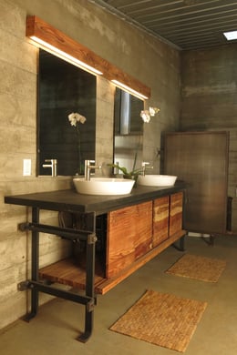 A limited materials palette of wood, steel, and concrete are used throughout the house and the custom furnishings. | John Russell