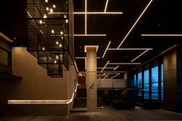 Sansui Lobby lit at night showcasing custom pendant light | Masahiro Miyashita