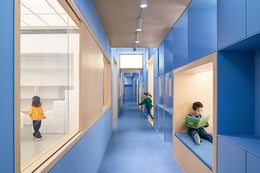 The blue spine facilitates a smooth transition from public, to semi-public (corridor), to private area (classroom) | BAI Yu