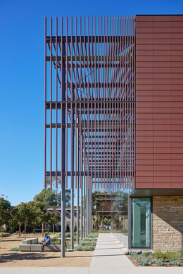 Fronted by a terra cotta umbra and a grove of flowering trees that shade outdoor and indoor workspaces, Henley Hall builds on Santa Barbara’s fabric of low-rise massing and rich materials in harmony with t | Photo © Bruce Damonte