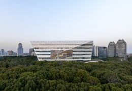 From the exterior, the library appears to “float” above two pavilions creating the image of a library in a garden. | RAWVISION Studio