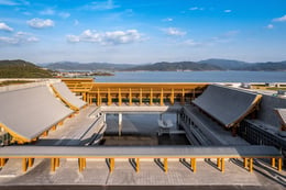 River flowing through the building, as two bridges crossing the water acting as public infrastructure allowing through traffic. | Ningbo International Conference Center Management Co., Ltd.