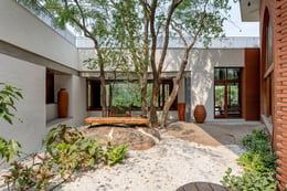 We used earthy, local materials, shaped and worked by local hands. A wall of the outdoor verandah was whittled away to make way for the tree to grow through the cut-out. The arrangement of each room was orientated towards nature | Vinay Panjwani