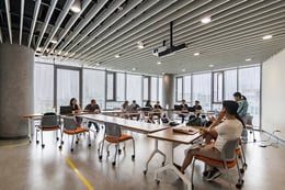 Interior of typical large classroom space with views towards the city and surrounding mountains | Renzo Rebagliati