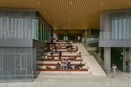 Outdoor amphitheater creates a pause in the building’s facade screening as a window to the campus | Eleazar Cuadros