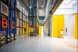 Warehouse : The high ceiling warehouse area is designed for effiency, showcasing well-organized storage systems, ample space, and strategic use of natural light for a sustainable and functional storage solutions. | © Spaceshift Studio