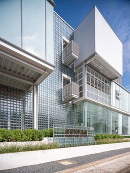 Building Façade Detail : Close-up of the building’s facade, focusing on the intricate use of different glass wall types and modern design elements that define its exterior. | © Spaceshift Studio