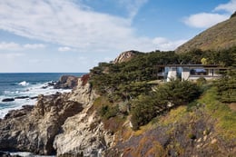 South facade nestled into the landscape, with the Santa Lucia mountains beyond. | Joe Fletcher