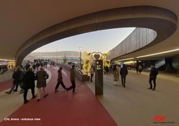 Main entrance of ChorusLife, marked by the large central ring with an empty space in the middle — a symbol of the project's design philosophy of "emptiness above fullness." The ring houses part of the sky jogging track and, within it, the wellness spa. | JDParchitects