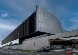 On the street side, the Arena breaks from mirrored symmetry with a sharp cut and a distinct architectural design, marking the boundary between the project and the city. This formal choice lets the Arena read as a semicircle, echoing the structure of a Gre | JDParchitects
