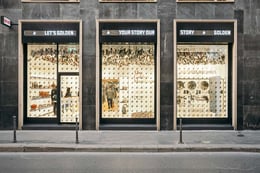 Retail Concept Golden TV - Courtesy of Golden Goose | A sequence of luminous signs scrolling over the store’s window and an LED wall broadcasting a video about the brand’s history beckon passers-by into the  Via Verri store.