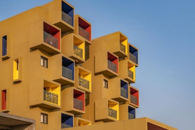 Studios 90, a sculptural residential project with a composition of coloured cuboids