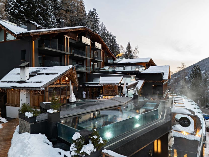 A Pool Floating Between the Sky and the Mountains