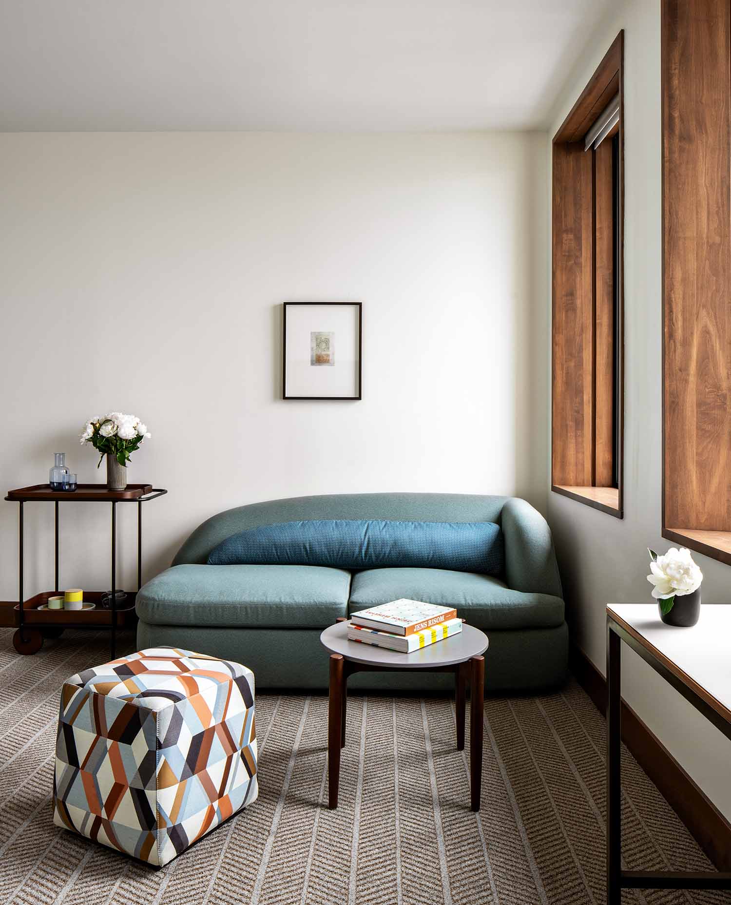 Hotel Marcel - © Seamus Payne, courtesy Becker + Becker | The furnishings combine the warmth of wood, which frames the windows, and sandy, earthy tones plus gray, which alludes to the concrete exterior. While maintaining the original architecture’s brutalist rigor, the brief for the interior design was to create comfortable spaces.
